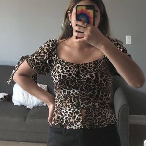LEOPARD PRINT PEPLUM TOP WITH TIE SLEEVES